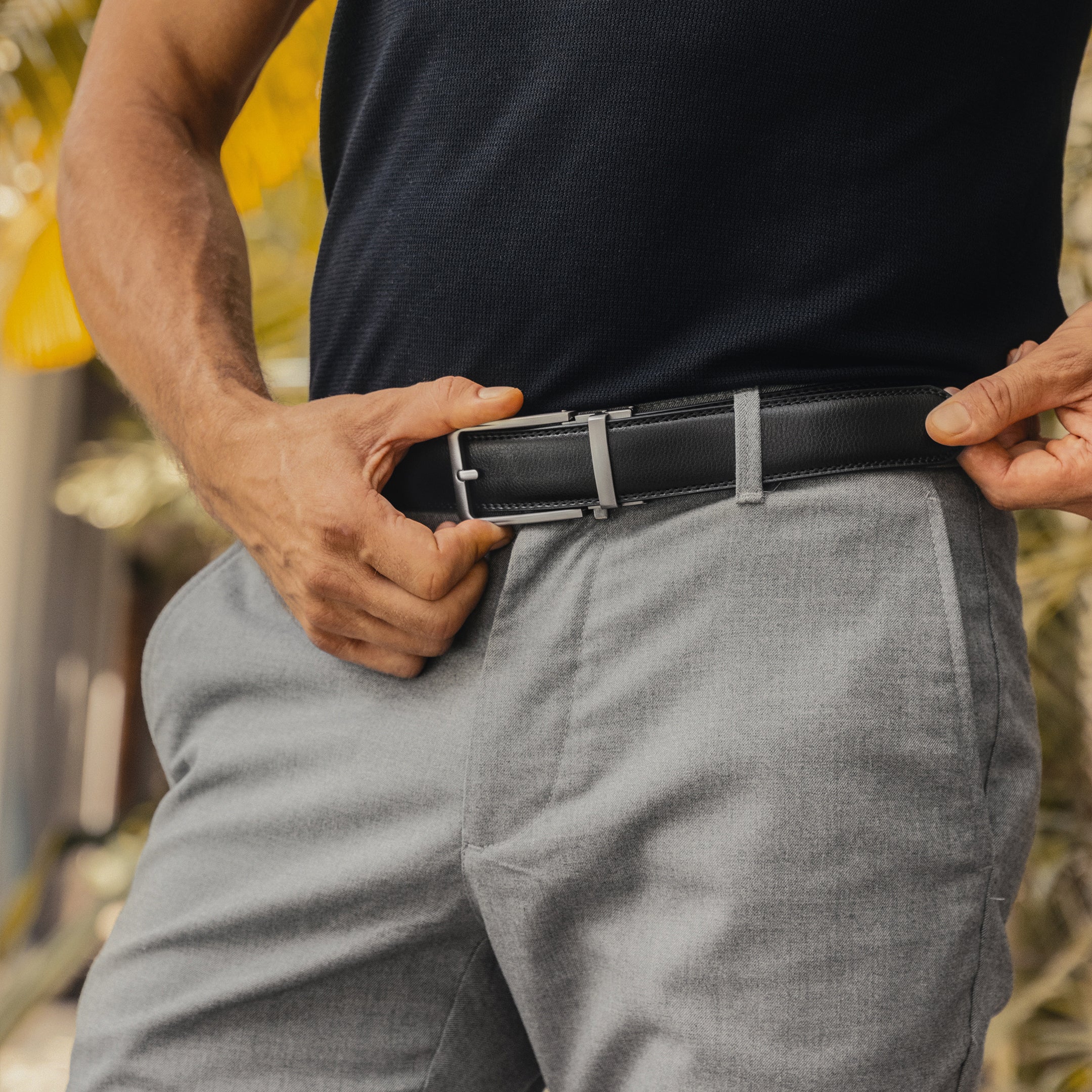 black leather belt with silver buckle